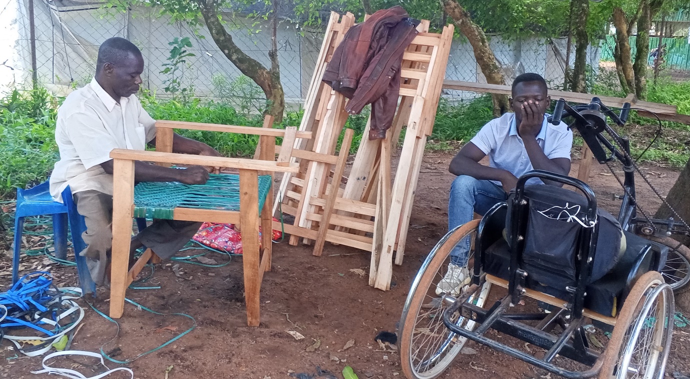 Dorugu Stephen making locally crafted chairs at his roadside workshop in Yambio