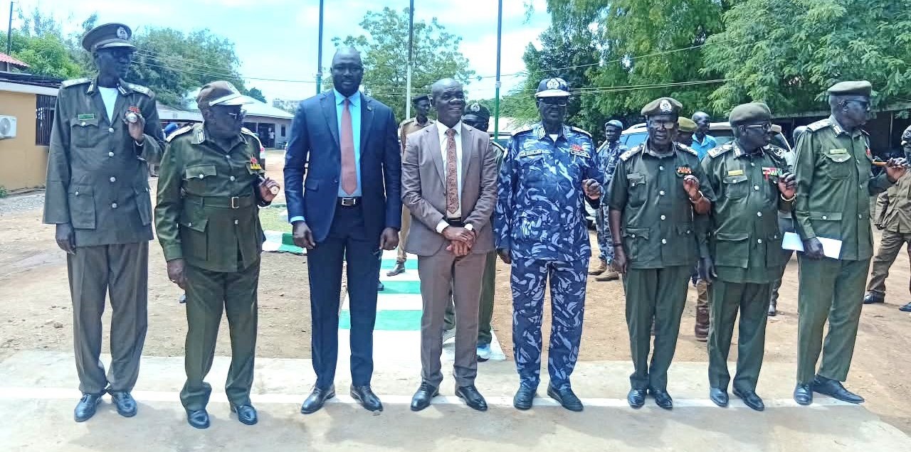 Caretaker Interior Minister, Rizik Zachariah Hassan in middle with officers of National Prison Services during inspection on Tuesday (Photo by Jenifer James)